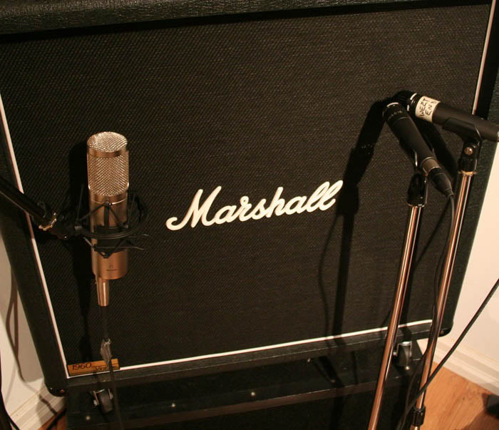 a microphone into guitar amp