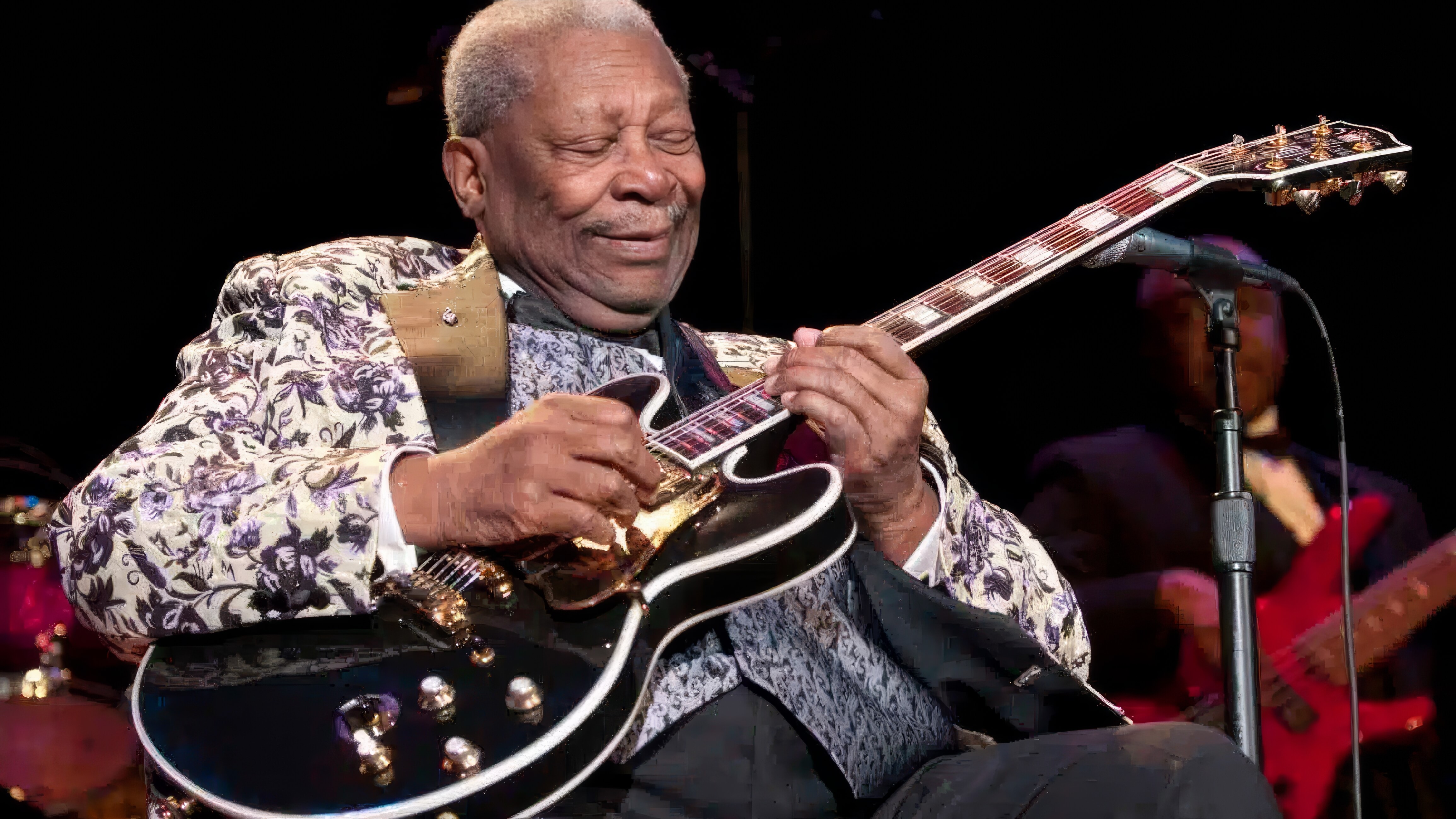 Blues guitar player performing on stage