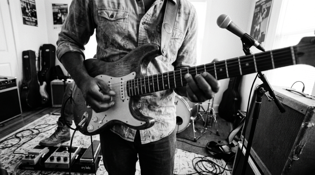 guitarist playing pinch harmonics