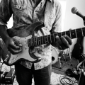 guitarist playing pinch harmonics